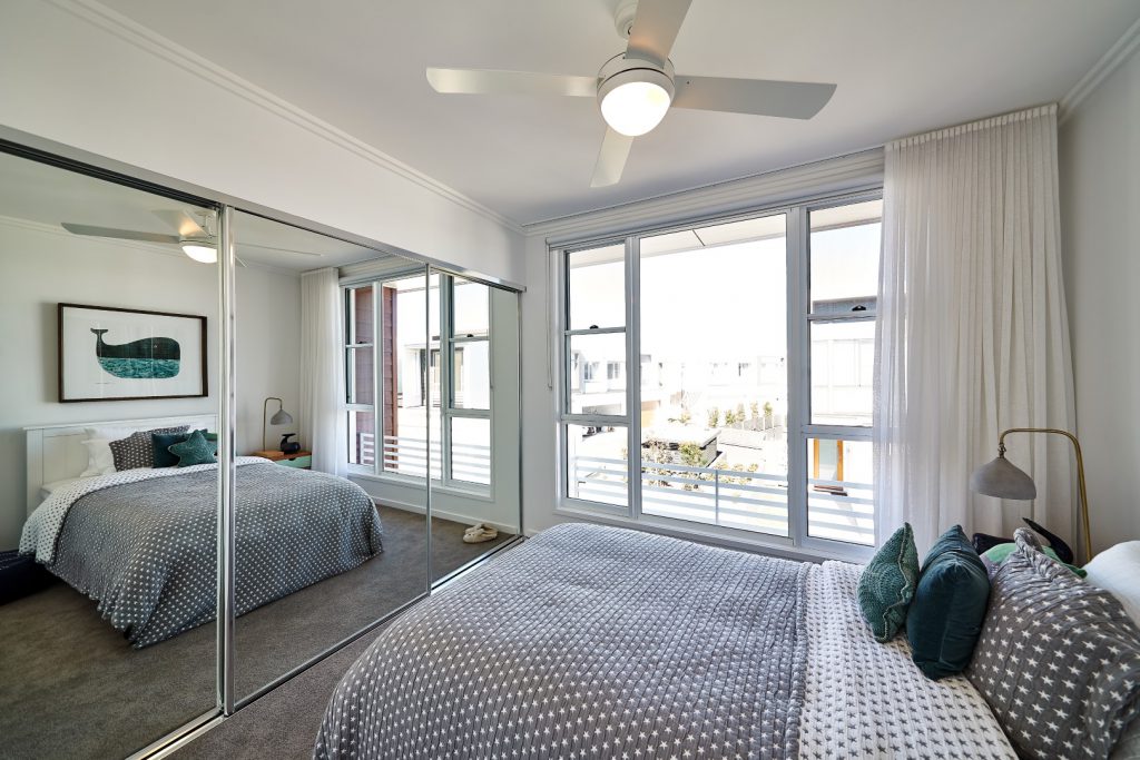 mirrored wardrobe doors in a bedroom